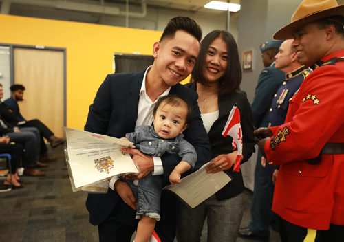 RUTH BONNEVILLE / WINNIPEG FREE PRESS 


Standup photo 
Six- month-old Edzard Guiao is wide-eyed while having his photo taken with his parents Edzelfen Guiao (dad) and Liramar Guiao (mom) after they receive their Canadian Citizenship at a formal ceremony at The Winnipeg Police Service HQ Thursday.



September 12/18 
