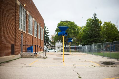 MIKAELA MACKENZIE / WINNIPEG FREE PRESS
The concrete play area is fenced off from the field after the field was found to have more than 1,000 mg/g lead levels in some parts at Weston School in Winnipeg on Thursday, Sept. 13, 2018.  
Winnipeg Free Press 2018.