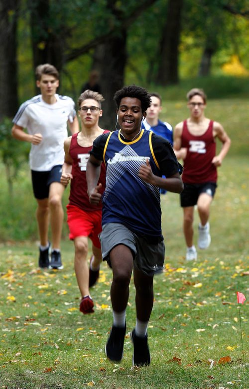 PHIL HOSSACK / WINNIPEG FREE PRESS - Mustafa Ahmed of the St James Jimmies leads a group of runners in the Jr. Varsity Boys Cross Country Run work their way around LaBarrier Park Thursday afternoon Ahmed finished 3rd. - Sept 13, 2018