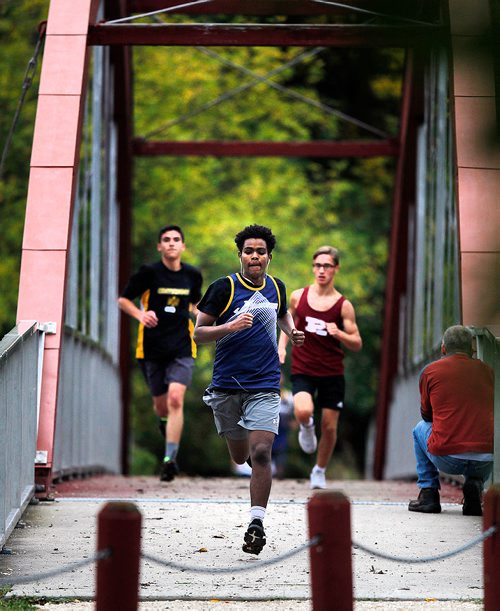PHIL HOSSACK / WINNIPEG FREE PRESS - Mustafa Ahmed of the St James Jimmies leads a group of runners in the Jr. Varsity Boys Cross Country Run work their way across the LaSalle RIver and around LaBarrier Park Thursday afternoon. Ahmed finished 3rd in the event. - Sept 13, 2018
