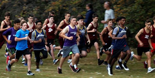 PHIL HOSSACK / WINNIPEG FREE PRESS - Jr Varsity Boys Cross Country Runners sprint off the start line and work their way across the LaSalle RIver and around LaBarrier Park Thursday afternoon in- Sept 13, 2018