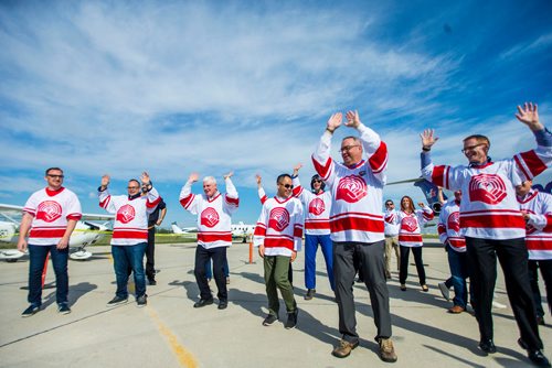 MIKAELA MACKENZIE / WINNIPEG FREE PRESS
The United Way team warms up at the United Way plane pull challenge at the Red River College Stevenson Campus in Winnipeg on Friday, Sept. 14, 2018.  
Winnipeg Free Press 2018.