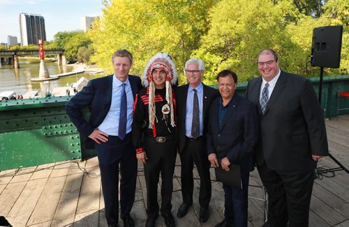 RUTH BONNEVILLE / WINNIPEG FREE PRESS 


The Government of Canada announces support for acquisition and repair of Churchill rail line by Arctic Gateway Group at press conference  held on the Forks historic bridge Friday.

Key players in attendance stand together for a group photo after presser.  Names from left: 
Fairfax President Paul Rivett, Grand Chief Arlen Dumas, 
MP Jim Carr (Minister of International Trade Diversification), mayor of Churchill Mike Spence and AGT Food Inc. director of corporate affairs Omer Al-Katib. 

See Martin Cash story. 

September 14/18 
