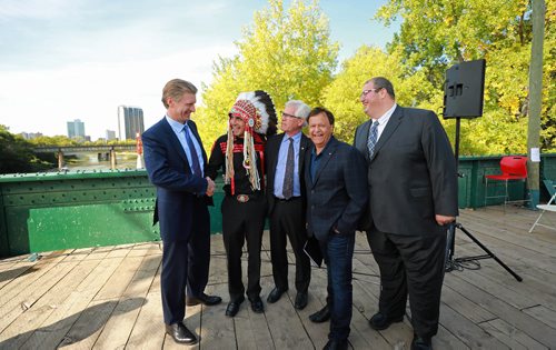 RUTH BONNEVILLE / WINNIPEG FREE PRESS 


The Government of Canada announces support for acquisition and repair of Churchill rail line by Arctic Gateway Group at press conference  held on the Forks historic bridge Friday.

Key players in attendance stand together for a group photo after presser.  Names from left: 
Fairfax President Paul Rivett, Grand Chief Arlen Dumas, 
MP Jim Carr (Minister of International Trade Diversification), mayor of Churchill Mike Spence and AGT Food Inc. director of corporate affairs Omer Al-Katib. 

See Martin Cash story. 

September 14/18 
