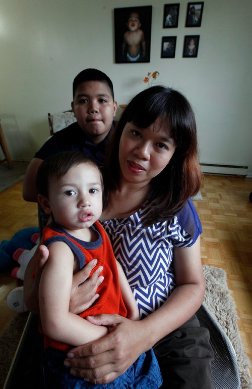 PHIL HOSSACK / WINNIPEG FREE PRESS - Janice Briones poses in her apartment with her son Justin (13) and Xander (2yrs). She and her kids were kicked off a transit bus last week. See Carol Sanders story. - Sept 14, 2018