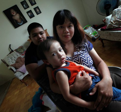 PHIL HOSSACK / WINNIPEG FREE PRESS - Janice Briones poses in her apartment with her son Justin (13) and Xander (2yrs). She and her kids were kicked off a transit bus last week. See Carol Sanders story. - Sept 14, 2018