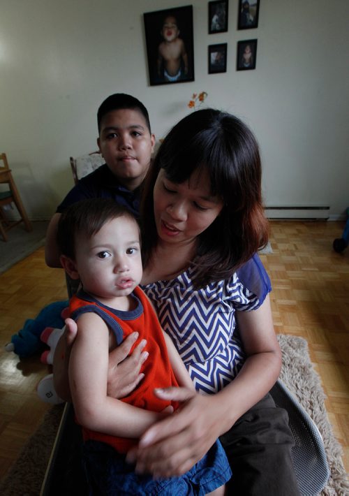 PHIL HOSSACK / WINNIPEG FREE PRESS - Janice Briones poses in her apartment with her son Justin (13) and Xander (2yrs). She and her kids were kicked off a transit bus last week. See Carol Sanders story. - Sept 14, 2018