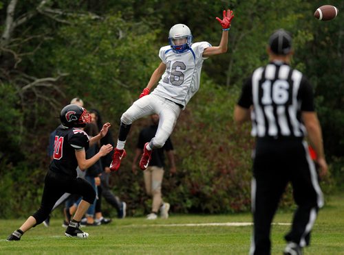 PHIL HOSSACK / WINNIPEG FREE PRESS - Oak Park Raider #16 Justice Flett flew high but not high enough for the pass that eluded his grasp Friday afternoon at Grant Park against the Sisler Spartans. Spartan #20 Kyle Bolton follows up. - Sept 14, 2018