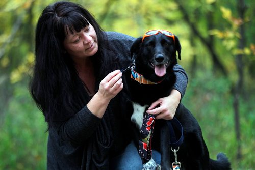 PHIL HOSSACK / WINNIPEG FREE PRESS - Carrie Orton and her pooch 'Mistltoe' show off her hand crafted collars and bandanas for dogs. See Dave Sanderson's Pet Page story.  - Sept 14, 2018