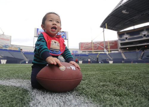 TREVOR HAGAN / WINNIPEG FREE PRESS
Landen Kwong, 14mo, on the field at Fan Fest, Sunday, September 16, 2018.