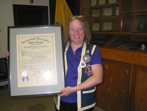 Canstar Community News Sept. 12, 2018 - Portage la Prairie Lions Club member and Zone 11 membership chair Anita Hart holds the club's charter signed in 1930. (ANDREA GEARY/CANSTAR COMMUNITY NEWS)