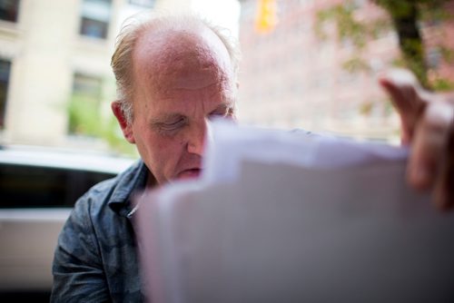 MIKAELA MACKENZIE / WINNIPEG FREE PRESS
Antero Lindblad puts up posters in the Exchange District in Winnipeg on Friday, Sept. 14, 2018.  Lindblad has made his living for over 20 years by doing this, for 25 cents a poster.
Winnipeg Free Press 2018.