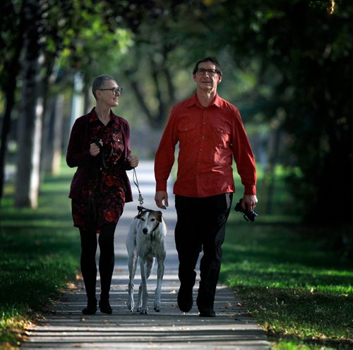 PHIL HOSSACK / WINNIPEG FREE PRESS - David Firman, his wife Gail Perry and their Greyhound Styxx at home Tuesday afternoon. See Borders story by Kittie Wong. - Sept 18, 2018