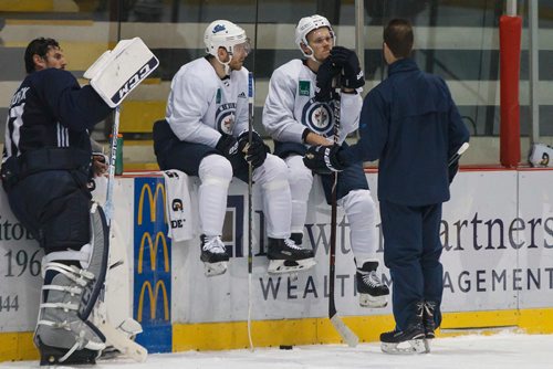 MIKE DEAL / WINNIPEG FREE PRESS
Winnipeg Jets' Bryan Little (18) and Nikolaj Ehlers (27) talk to assistant coach Jamie Kompon during training camp Wednesday morning at the BellMTS Iceplex.
180919 - Wednesday, September 19, 2018.