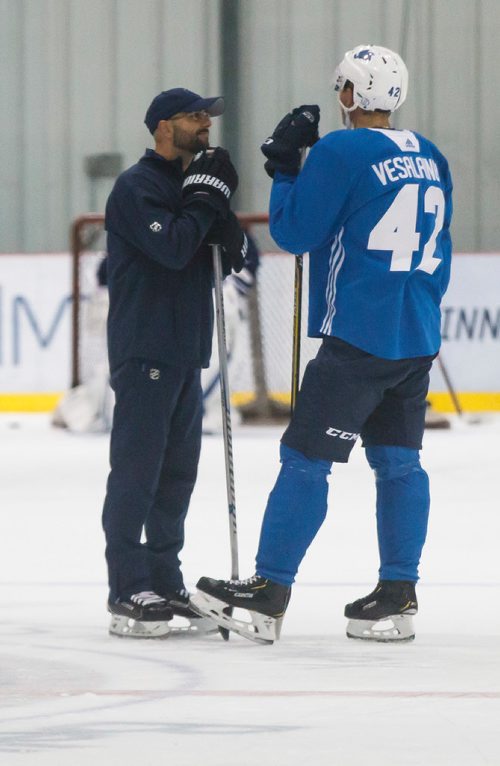 MIKE DEAL / WINNIPEG FREE PRESS
Winnipeg Jets' Kristian Vesalainen (42) talks to Manitoba Moose head coach Pascal Vincent during training camp Wednesday morning at the BellMTS Iceplex.
180919 - Wednesday, September 19, 2018.