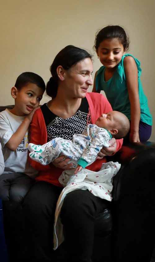 RUTH BONNEVILLE / WINNIPEG FREE PRESS 

LOCAL - 49.8 Feature
Portrait of of Yazidi mom with her kids and new baby taken Safiya Maroo's home.   For feature on the ethnocultural group that faced genocide in northern Iraq having children and growing families here in Winnipeg- they went from escaping death at hands of ISIS to producing new life as refugees in a safe place. 

Names:
Mom, Safiya Maroo  with her 3 kids. One girl (Madleen, 7yrs old), 2 boys, Salam who is 51/2 yrs and Sam who is 3 weeks.
 

Carol Sanders  | Reporter


September 19/18 
