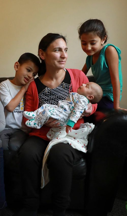 RUTH BONNEVILLE / WINNIPEG FREE PRESS 

LOCAL - 49.8 Feature
Portrait of of Yazidi mom with her kids and new baby taken Safiya Maroo's home.   For feature on the ethnocultural group that faced genocide in northern Iraq having children and growing families here in Winnipeg- they went from escaping death at hands of ISIS to producing new life as refugees in a safe place. 

Names:
Mom, Safiya Maroo  with her 3 kids. One girl (Madleen, 7yrs old), 2 boys, Salam who is 51/2 yrs and Sam who is 3 weeks.
 

Carol Sanders  | Reporter


September 19/18 
