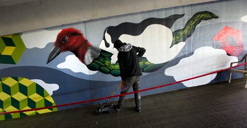 PHIL HOSSACK / WINNIPEG FREE PRESS - Toronto Artist Jerry Rugg works on a mural at the Forks Parkade Wednesday. Also known as 'Birdo', hes one of a group of artists taking part in the Wall to Wall Festival here in the city. See release? - Sept 19, 2018
