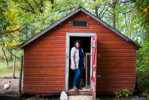 MIKAELA MACKENZIE / WINNIPEG FREE PRESS
Tracy Wood comes out of the chicken coop at Farm Away, just outside of Portage la Prairie, on Wednesday, Sept. 19, 2018.  
Winnipeg Free Press 2018.