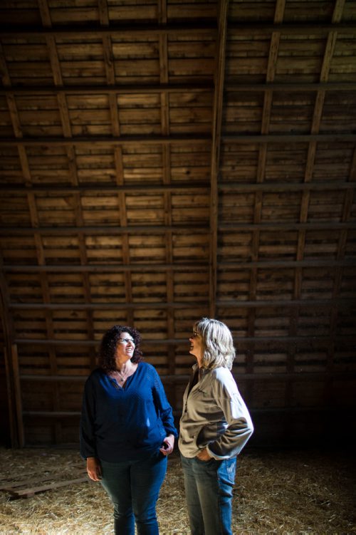 MIKAELA MACKENZIE / WINNIPEG FREE PRESS
Tracy Wood (left) and Taralea Simpson imagine how the barn would look as a music venue at Farm Away, just outside of Portage la Prairie, on Wednesday, Sept. 19, 2018.  
Winnipeg Free Press 2018.