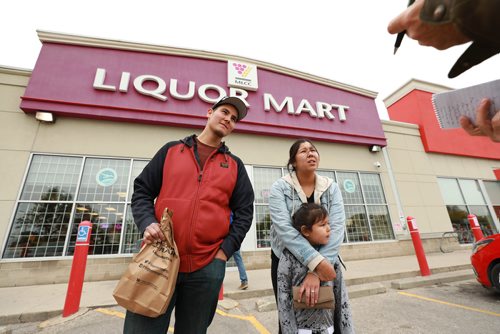 RUTH BONNEVILLE  /  WINNIPEG FREE PRESS


Andreas Thompson with his partner Theressa Genaille and her daughter, talks to a reporter about his views on the recent surge of thefts at Manitoba Liquor Marts while leaving a MLCC store on Portage Ave. near Arlington St. Thursday. 

Three different people interviewed and photographed for this streeted. 

See Kevin Rollason's story.  

SEPT 20,2018