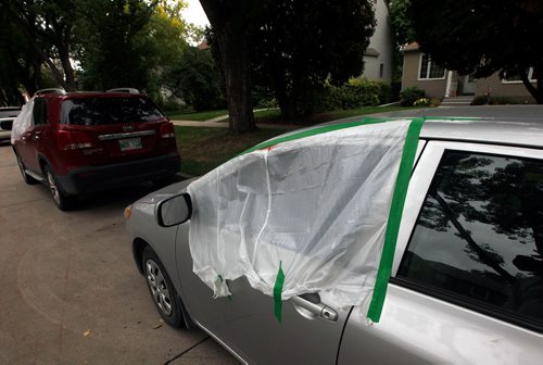 PHIL HOSSACK / WINNIPEG FREE PRESS -A pair of vandalized autos on Ash St just north of Corydon. See story. - Sept20, 2018