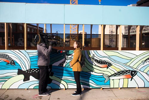 MIKAELA MACKENZIE / WINNIPEG FREE PRESS
Inuit artist Kailey Sheppard speaks to the media in front of her work on the on the pedestrian walkway outside the Winnipeg Art Gallery in Winnipeg on Friday, Sept. 21, 2018. The mural is titled "Mosaic Sea," and layers Inuit imagery through a collage-based process. Winnipeg Free Press 2018.