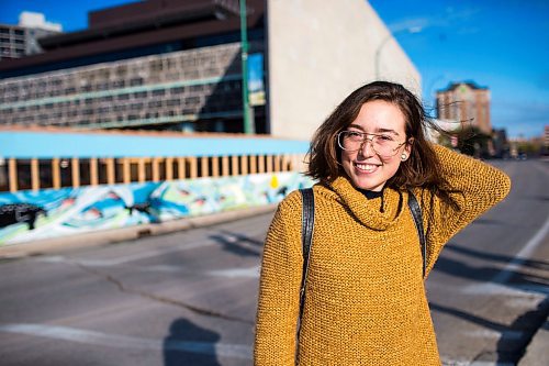 MIKAELA MACKENZIE / WINNIPEG FREE PRESS
Inuit artist Kailey Sheppard poses in front of her work on the on the pedestrian walkway outside the Winnipeg Art Gallery in Winnipeg on Friday, Sept. 21, 2018. The mural is titled "Mosaic Sea," and layers Inuit imagery through a collage-based process. Winnipeg Free Press 2018.