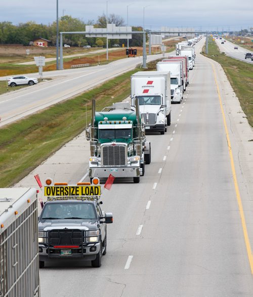 MIKE DEAL / WINNIPEG FREE PRESS
The World's Largest Truck Convoy for Special Olympics makes its way west on the north perimeter Saturday morning. The project is put together by the organizers of the Law Enforcement Torch Run working in conjunction with members of the trucking industry in an effort to raise funds and awareness. It departed Île-des-Chênes mid-morning and headed north on Highway 59, around the Perimeter Highway and returned to Île-des-Chênes. It's estimated that 200 trucks drove in the convoy.
180922 - Saturday, September 22, 2018.