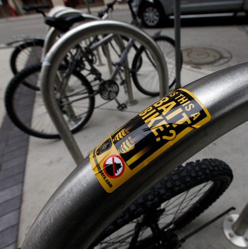 PHIL HOSSACK / WINNIPEG FREE PRESS - Bait Bike stickers on bicycle lock racks downtown at the Millenium Library. See story.  - Sept 24, 2018