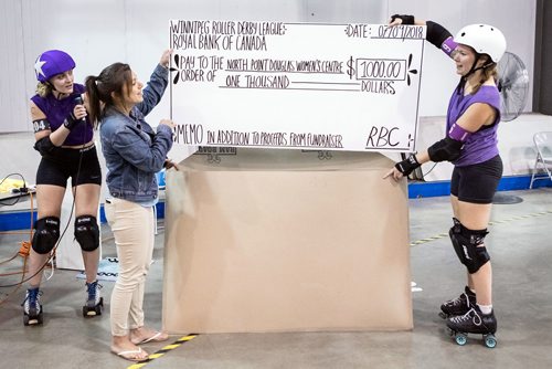 SUBMITTED PHOTO / MATT DUBOFF

Roller derby skaters Alex 'The Grape Gatsby' Krosney (left) and Andrea 'Raisin A Stink' Jungwirth (right)  present a cheque to Tara Zajac, executive director of the North Point Douglas Women's Centre, at the Winnipeg Roller Derby League's FUNraiser game in support of the North Point Douglas Women's Centre on Sept. 7, 2018. The donation was part of a total of $1,831 raised by the event in support of nutritional programs and more at North Point Douglas Women's Centre. (See Social Page)