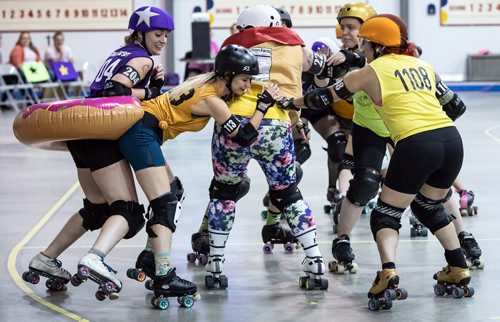 SUBMITTED PHOTO / MATT DUBOFF

Cowd buy-in options had skaters playing in inflatable doughnuts, peanut butter jars and other food-themed accessories at the Winnipeg Roller Derby League's FUNraiser game in support of the North Point Douglas Women's Centre on Sept. 7, 2018. (See Social Page)