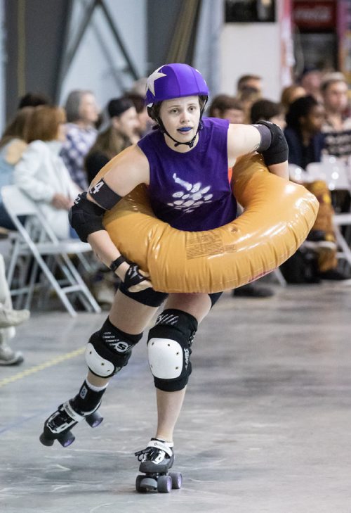 SUBMITTED PHOTO / MATT DUBOFF

Skater Shauna 'Master of Wine Arts' Matthews jams in an inflatable doughnut during the Winnipeg Roller Derby League's FUNraiser game in support of the North Point Douglas Women's Centre on Sept. 7, 2018. (See Social Page)