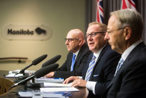 MIKAELA MACKENZIE / WINNIPEG FREE PRESS
Finance Minister Scott Fielding (centre) and other finance department officials speak to the media about the newly released public accounts at the Manitoba Legislative Building in Winnipeg on Friday, Sept. 28, 2018.  Winnipeg Free Press 2018.