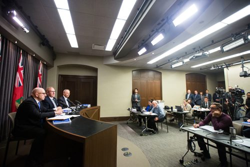 MIKAELA MACKENZIE / WINNIPEG FREE PRESS
Finance Minister Scott Fielding (centre) and other finance department officials speak to the media about the newly released public accounts at the Manitoba Legislative Building in Winnipeg on Friday, Sept. 28, 2018.  Winnipeg Free Press 2018.