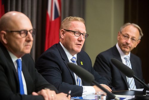 MIKAELA MACKENZIE / WINNIPEG FREE PRESS
Finance Minister Scott Fielding (centre) and other finance department officials speak to the media about the newly released public accounts at the Manitoba Legislative Building in Winnipeg on Friday, Sept. 28, 2018.  Winnipeg Free Press 2018.