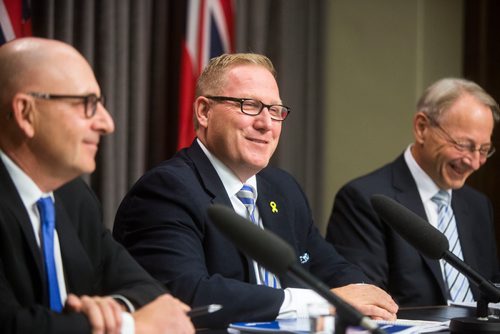 MIKAELA MACKENZIE / WINNIPEG FREE PRESS
Finance Minister Scott Fielding (centre) and other finance department officials speak to the media about the newly released public accounts at the Manitoba Legislative Building in Winnipeg on Friday, Sept. 28, 2018.  Winnipeg Free Press 2018.