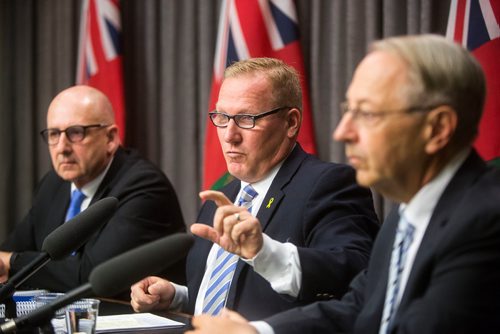 MIKAELA MACKENZIE / WINNIPEG FREE PRESS
Finance Minister Scott Fielding (centre) and other finance department officials speak to the media about the newly released public accounts at the Manitoba Legislative Building in Winnipeg on Friday, Sept. 28, 2018.  Winnipeg Free Press 2018.