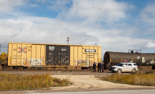 MIKE DEAL / WINNIPEG FREE PRESS
Police at the scene of a CN rail line where a person was hit by a train close to Wilks Ave. and Shaftesbury Blvd. Friday morning.
180928 - Friday, September 28, 2018.