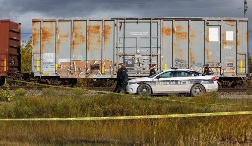 MIKE DEAL / WINNIPEG FREE PRESS
Police at the scene of a CN rail line where a person was hit by a train close to Wilks Ave. and Shaftesbury Blvd. Friday morning.
180928 - Friday, September 28, 2018.