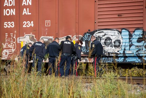 MIKE DEAL / WINNIPEG FREE PRESS
Police at the scene of a CN rail line where a person was hit by a train close to Wilks Ave. and Shaftesbury Blvd. Friday morning.
180928 - Friday, September 28, 2018.