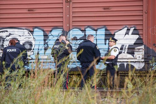 MIKE DEAL / WINNIPEG FREE PRESS
Police at the scene of a CN rail line where a person was hit by a train close to Wilks Ave. and Shaftesbury Blvd. Friday morning.
180928 - Friday, September 28, 2018.