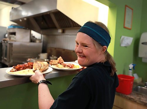 RUTH BONNEVILLE / WINNIPEG FREE PRESS

 SUNDAY SPECIAL - L'Arche Tova Cafe at 119 Regent Ave W


Restaurant  L'Arche Tova Cafe's mandate is to hire people with developmental and intellectual disabilities. 

A series of photos taken during the lunch hour at the restaurant.  

Stacey Friesen, with developmental disabilities and volunteers at the restaurant 3 times a week (black shirt with bandana), picks up a food order from kitchen.  


Story by Freelancer Kelsey James  

Sept 27, 2018