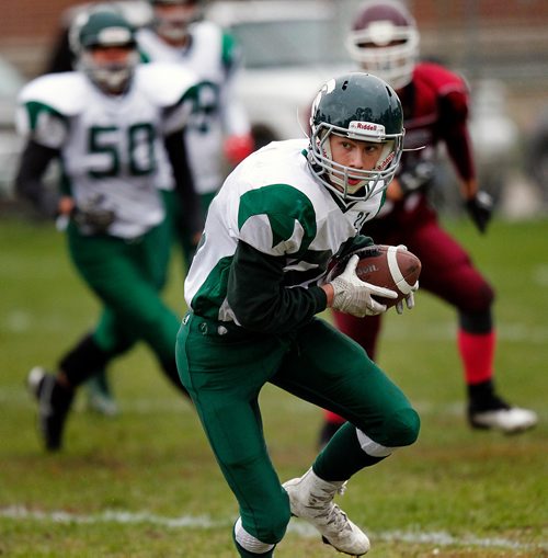 PHIL HOSSACK / WINNIPEG FREE PRESS - Neelin Spartans receiver #20 Gavin Hall looks downfield for his path after the recption Friday at DMCI. - Sept 28, 2018
