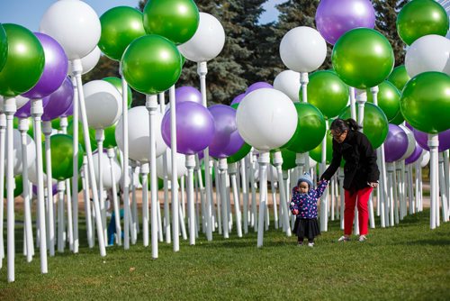 MIKE DEAL / WINNIPEG FREE PRESS
Arlene Valenzuela with her 18-month-old daughter, Alessia, as they check out an immersive art installation hosted by Telus on the hill by the CN Stage and Field at The Forks for Culture Days and Nuit Blanche.
180929 - Saturday, September 29, 2018.