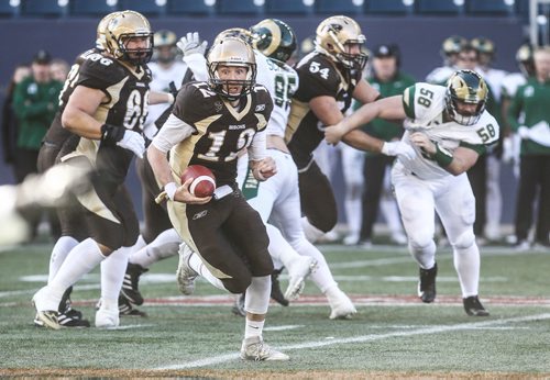 MIKE DEAL / WINNIPEG FREE PRESS
Manitoba Bisons' quarterback Des Catellier (12) runs the ball during a play in the second quarter against the Regina Rams at Investors Group Field.
The Regina Rams won in overtime 32-31 over the Manitoba Bisons in Canada West university football action at Investors Group Field Saturday afternoon.
180929 - Saturday, September 29, 2018.