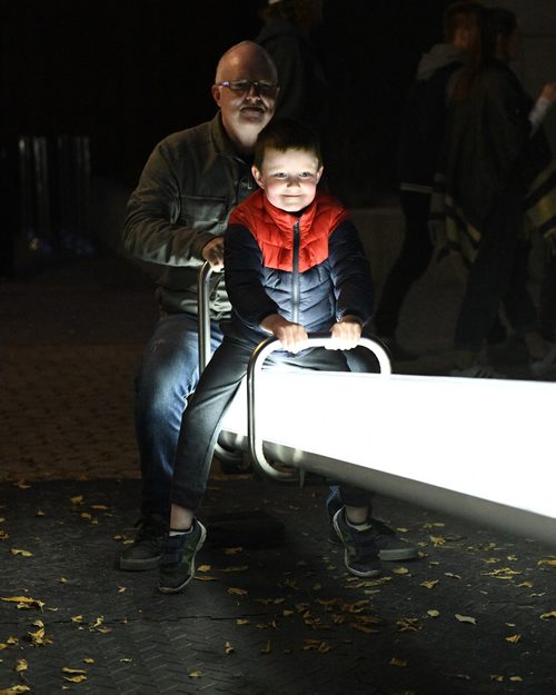 MIKE SUDOMA / WINNIPEG FREE PRESS
Paul and grandson, Cameron, enjoy the illuminated see-saws at The Cube during Nuit Blanche Saturday night. September 29, 2018