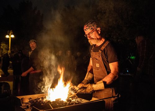 MIKE SUDOMA / WINNIPEG FREE PRESS
(left to right) Hubert Verrier and Steve Ducharme of Cloverdale Forge crafting various trinkets and tools during the Nuit Blanche Festival Saturday night. September 29, 2018