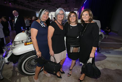 JASON HALSTEAD / WINNIPEG FREE PRESS

L-R: Sisters Anna, Maria, Gina and Isabella Carbone have a photo taken with Peter Nygård's classic car at the Nygård 50 Years in Fashion gala at the RBC Convention Centre Winnipeg on Sept. 14, 2018. (See Social Page)