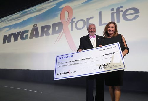 JASON HALSTEAD / WINNIPEG FREE PRESS

President and CEO of Nygard Fashions at Nygard International Jim Bennett presents a donation of $100,000 to CancerCare Manitoba president and CEO Annitta Stenning at the Nygard 50 Years in Fashion gala at the RBC Convention Centre Winnipeg on Sept. 14, 2018. (See Social Page)